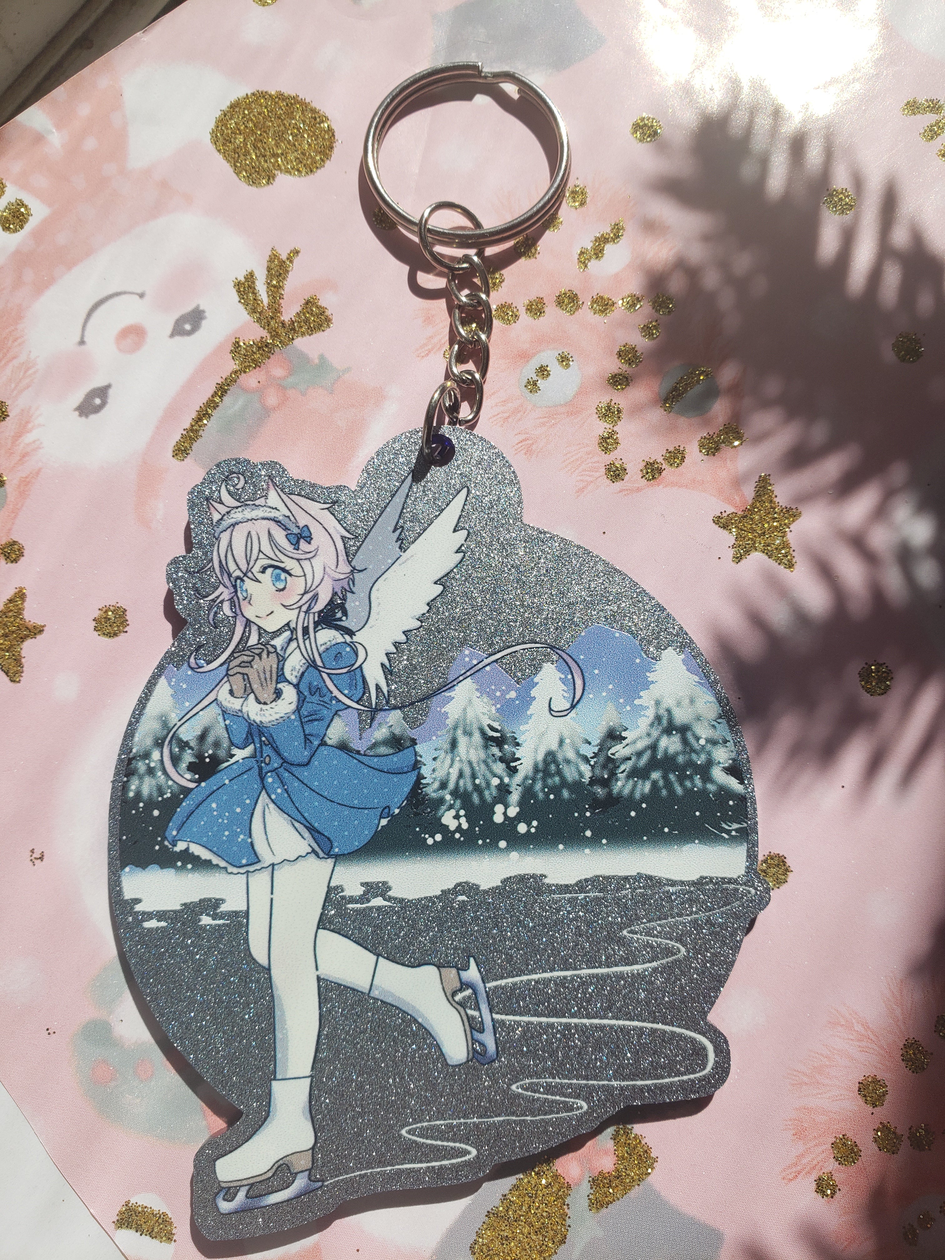 Iceskating snow angel keychain - blue glitter arcylic featuring character from Magical Princess Sky original manga