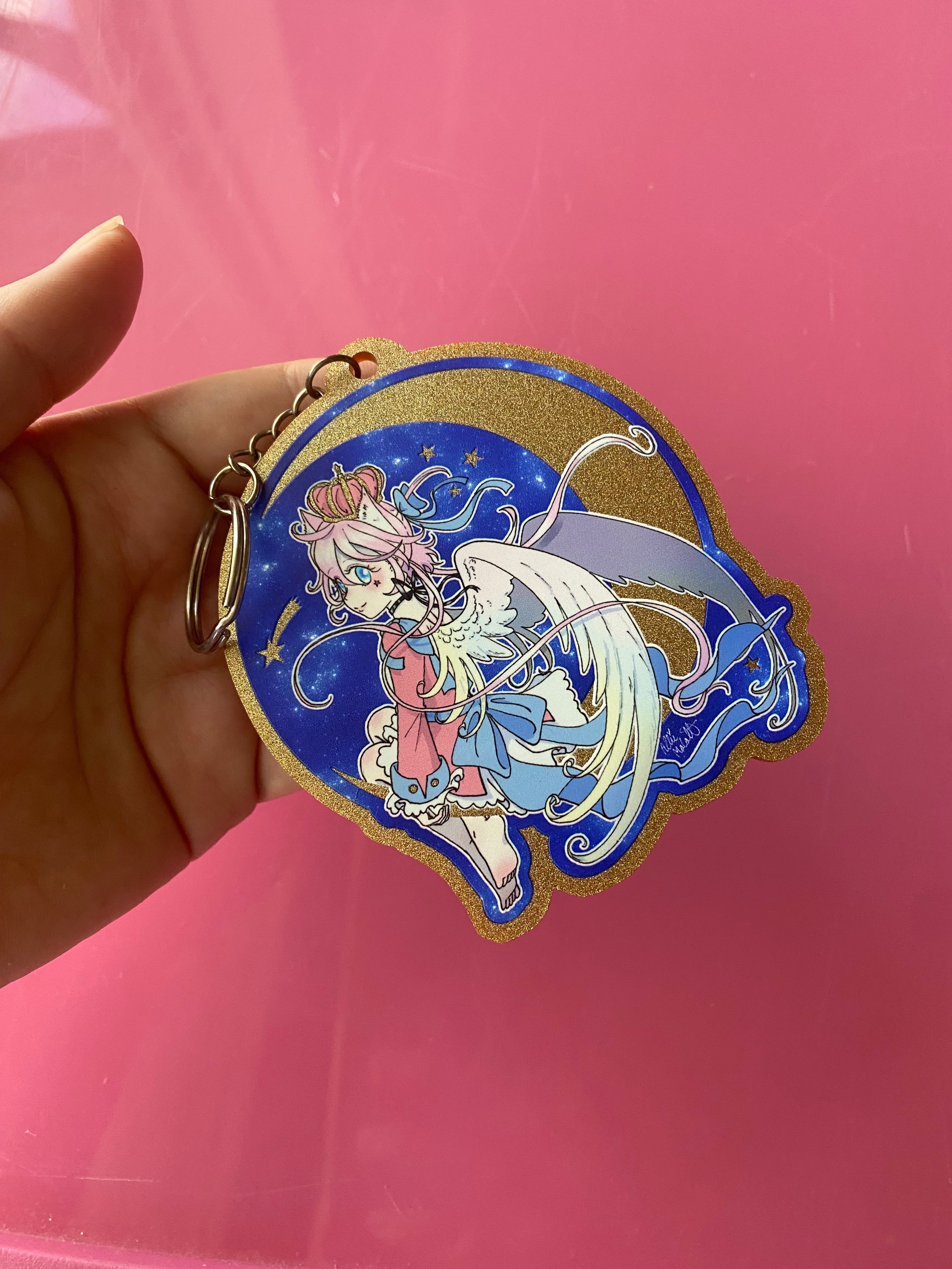 Magical girl angel sitting on the moon gold glitter acrylic charm keychain featuring original character from Magical Princess Sky manga